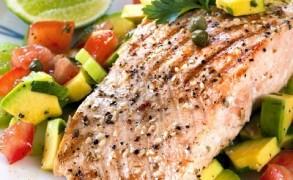 Salmon with Kale, Grape Tomatoes & Avocado dressed with Champagne Vinaigrette